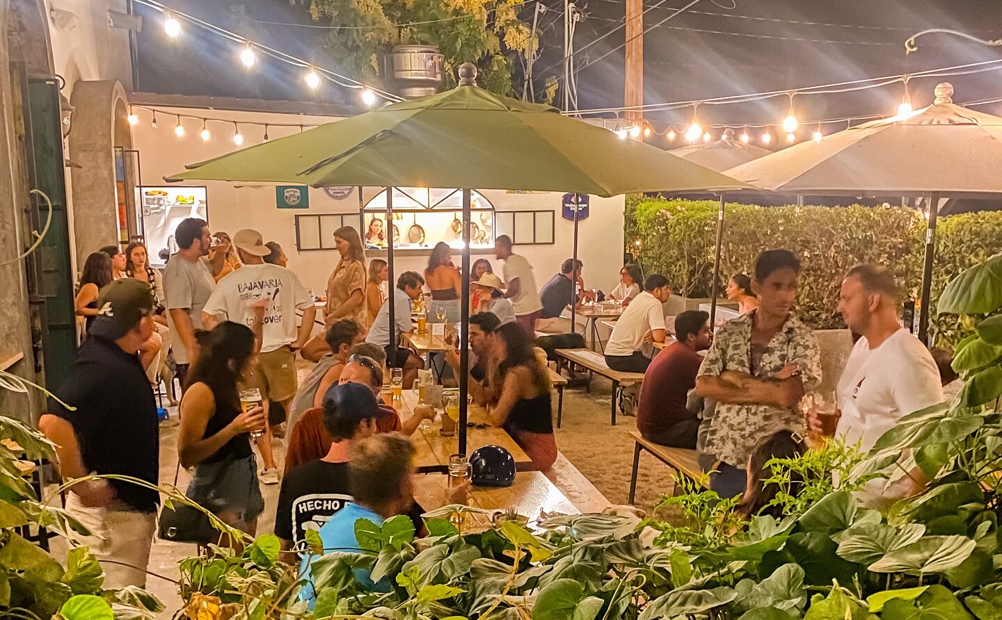 People enjoying drinks and food in Bajavaria in Todos Santos, Baja California Sur.